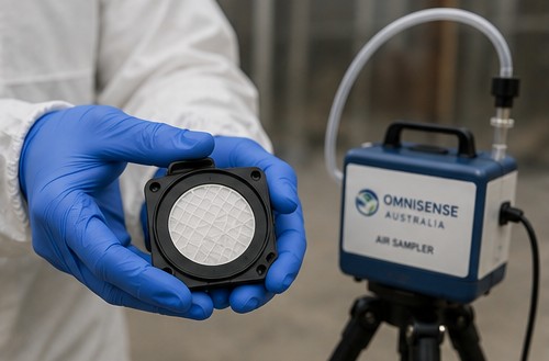 OmniSense Australia asbestos air sampler with a gridded MCE membrane filter cassette held by a gloved occupational hygienist.